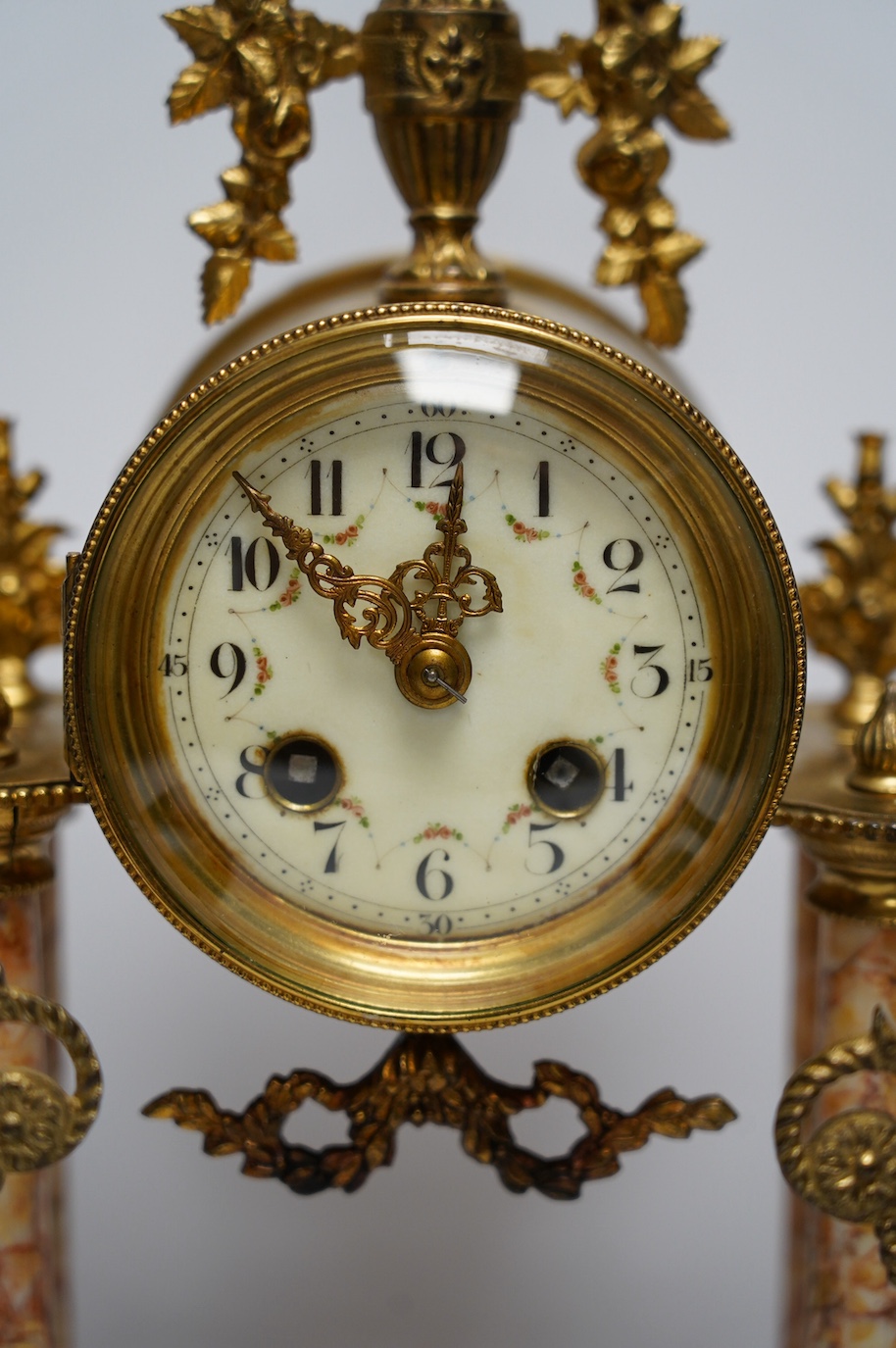 An early 20th century century French marble clock garniture, key and pendulum, 40cm. Condition - fair to good